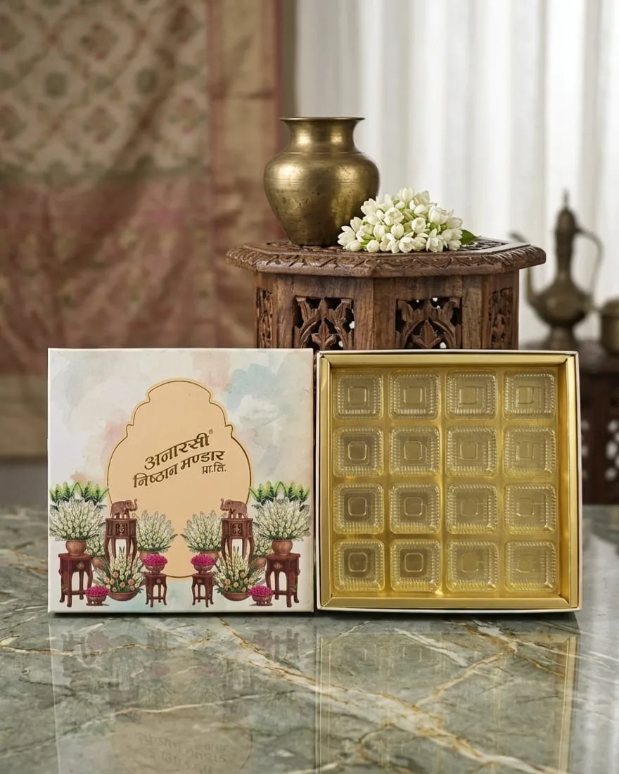 Sweet box beside its fitted gold tray