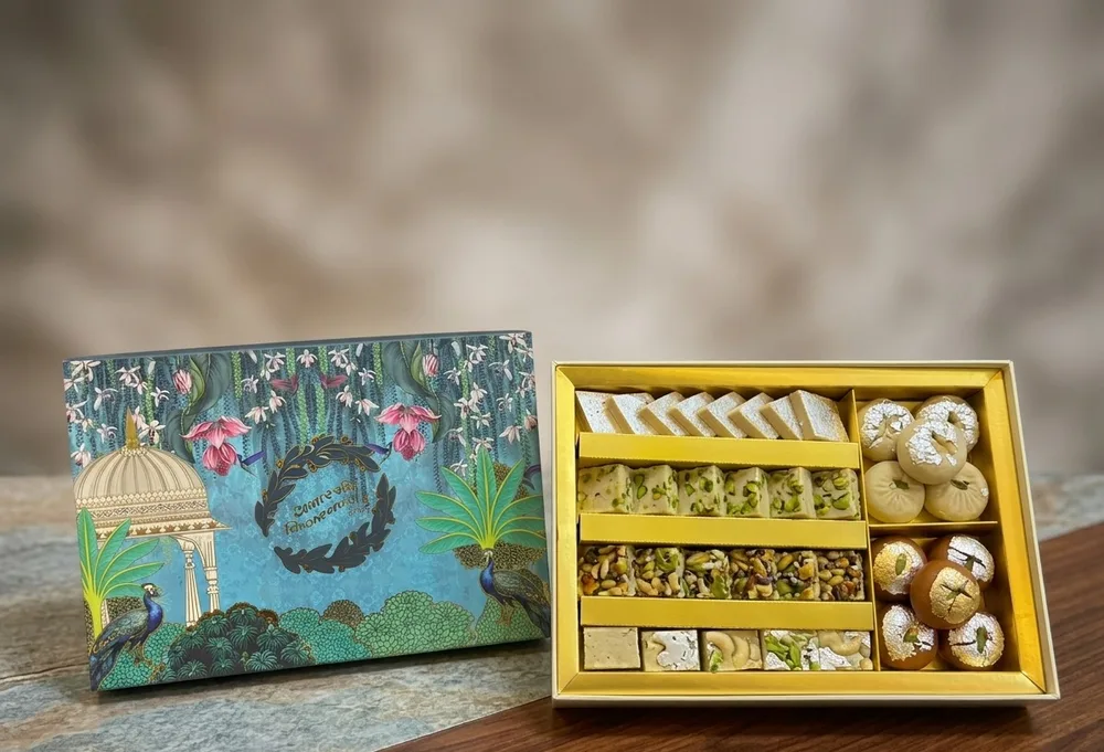 Printed mithai box with peacock and pavilion artwork