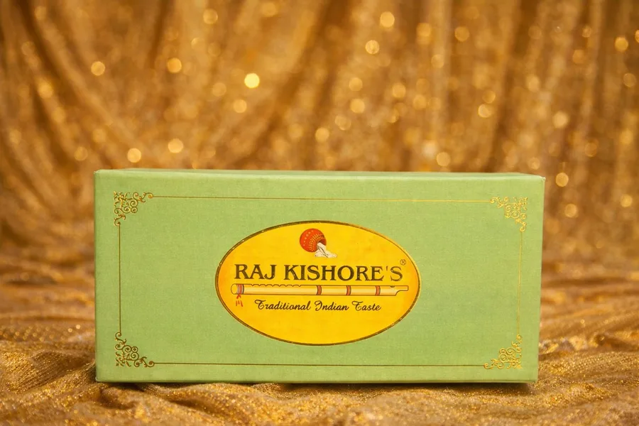 Green sweet box with gold brand oval