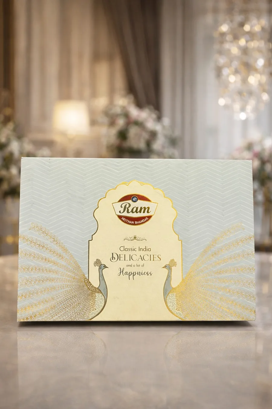 Cream sweet box with gold peacock print
